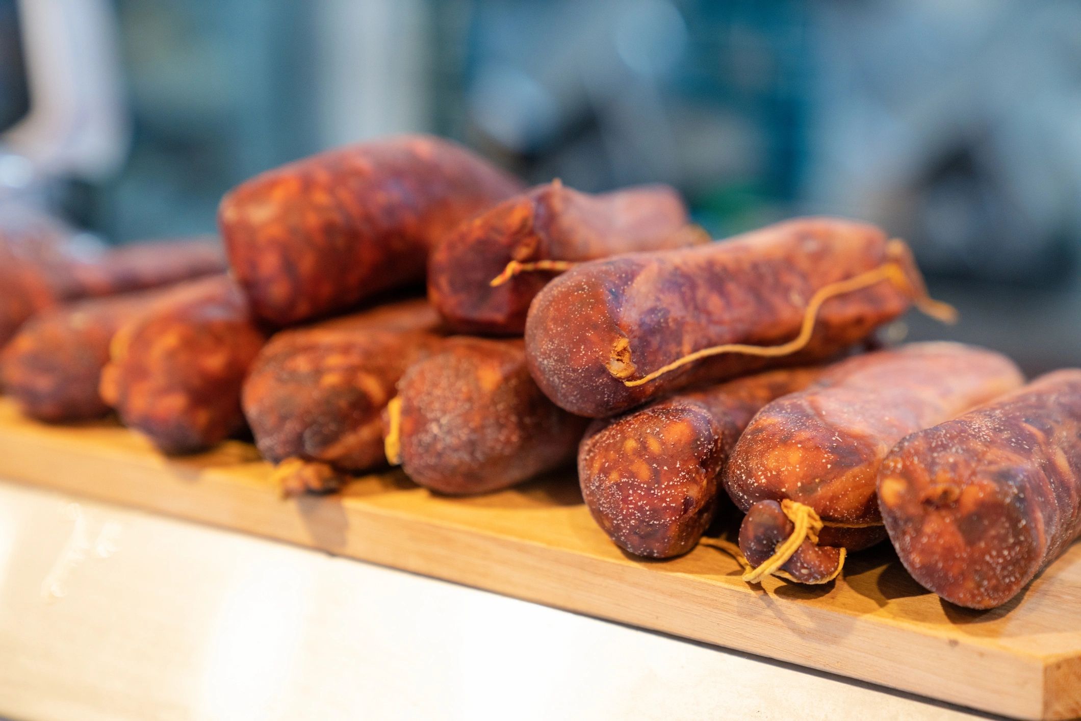 Fresh sausages piled on display